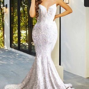 Beautiful white sequin gown NWT! Has excellent stretch!